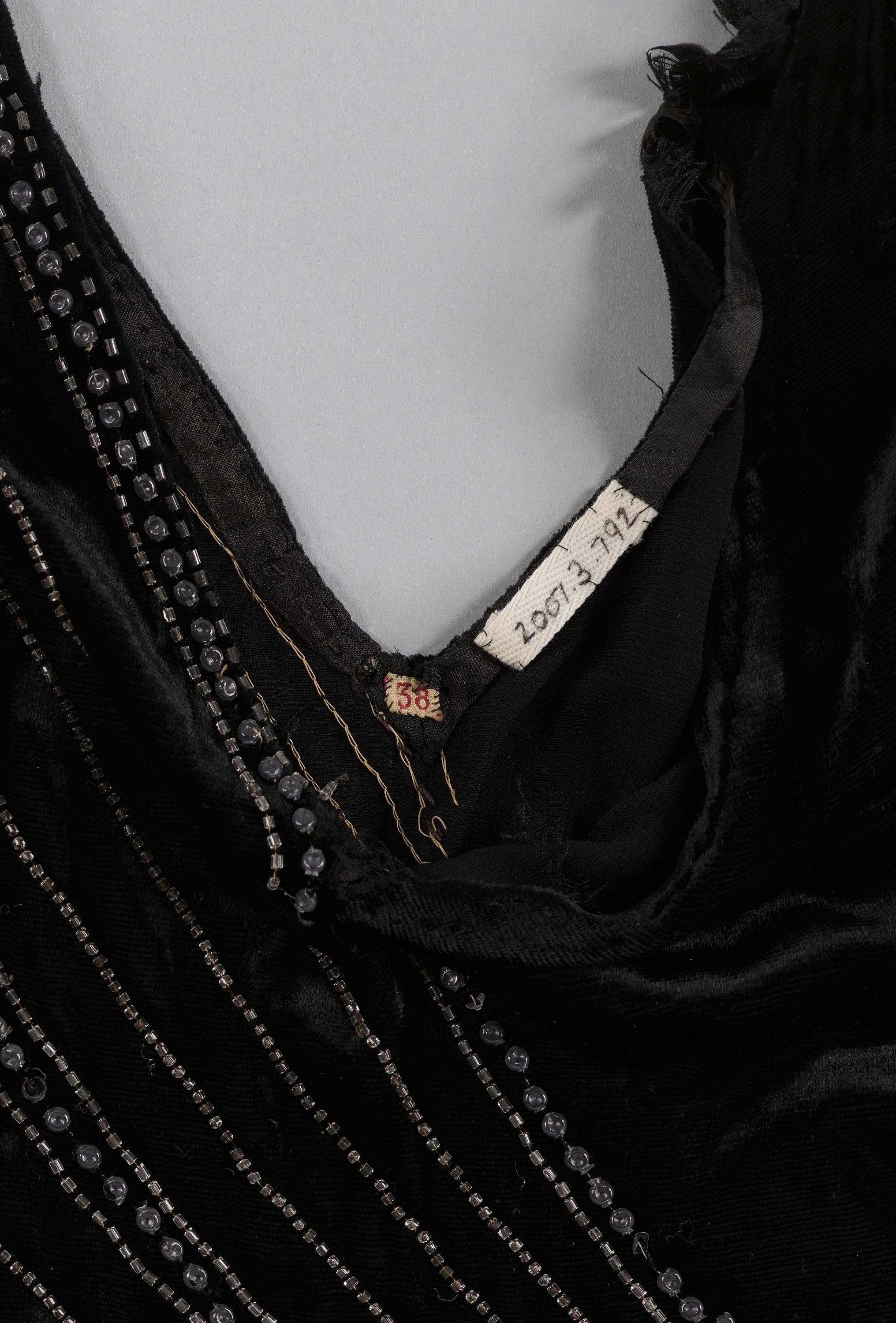 Black velvet dress with glass bead embellishments