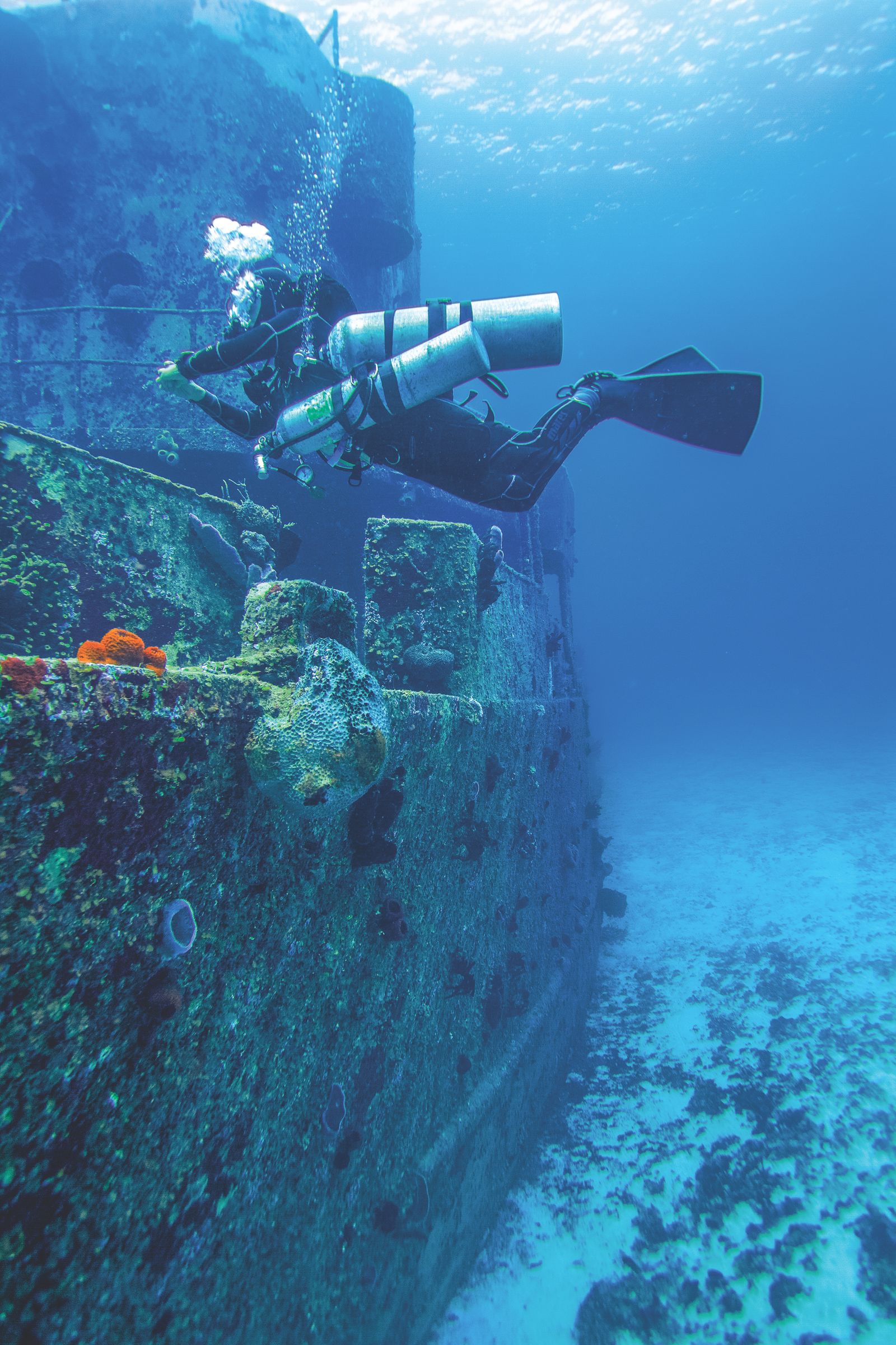 Scuba diver exploring a sunken ship